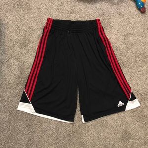 Adidas shorts. Medium size. Black and Red.